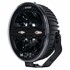 Runder, schwarzer LED-Scheinwerfer X-Spider mit dunkler Linse, silbernem Ring und geripptem Geh�use auf Halterung.