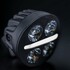 Rundes Strands LED Fahrlicht Nuuk MC 3 mit dunklem Geh�use, mehreren Linsen und hellem Positionslichtbalken.